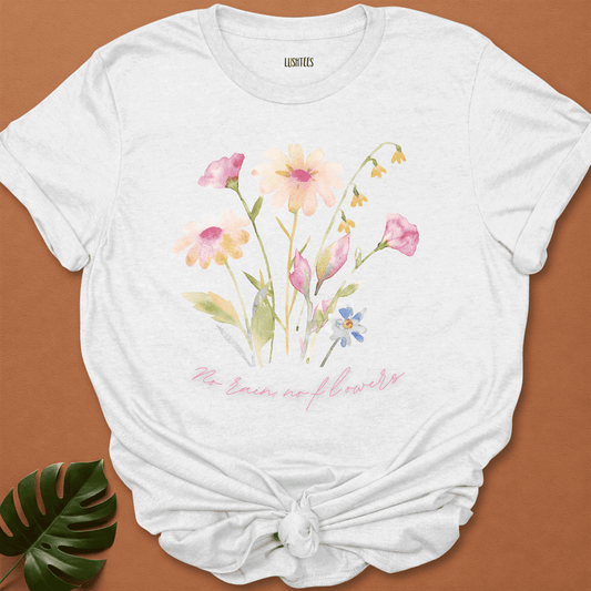 White t-shirt with floral design and text on a brown background